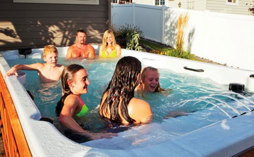 Family having fun in a swim spa
